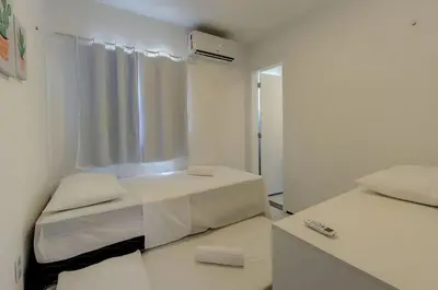 Uma cama ou camas num quarto em Beach Townhouses I Triplex Perto da Praia By Carpediem