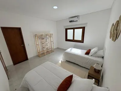 Uma cama ou camas num quarto em Casa - Elo Beach House