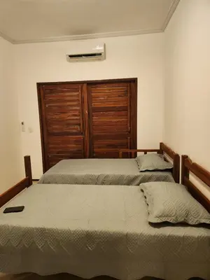 Uma cama ou camas num quarto em Dúplex Lagoa
