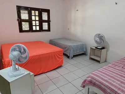 Uma cama ou camas num quarto em Presídio Beach House