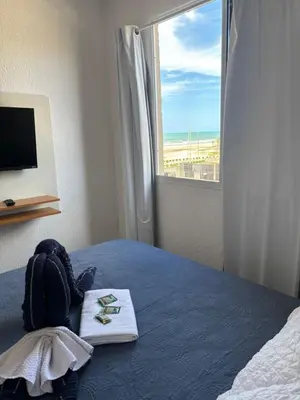 Uma cama ou camas num quarto em Vista Mar e Pé na Areia,Apartamento novo na Praia do Futuro bem próximo do Crocobeach