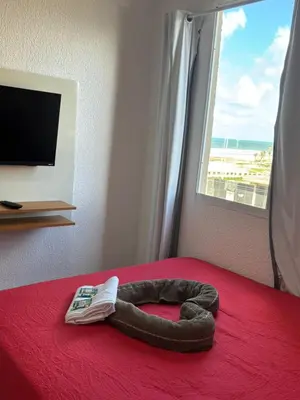 Uma cama ou camas num quarto em Vista Mar e Pé na Areia,Apartamento novo na Praia do Futuro bem próximo do Crocobeach