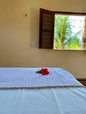 Uma cama ou camas num quarto em Casa Caju