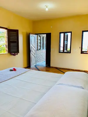Uma cama ou camas num quarto em Casa Caju