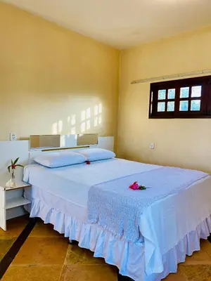 Uma cama ou camas num quarto em Casa Caju