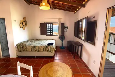 Uma cama ou camas num quarto em Refúgio das Falésias - Frente ao mar na Broadway