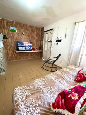 Uma cama ou camas num quarto em Green House Cumbuco