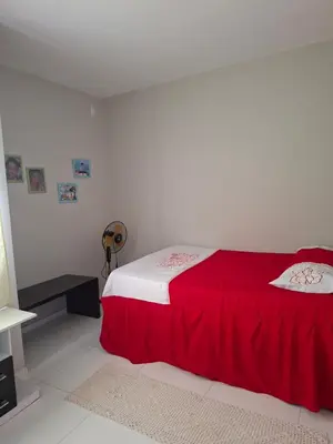 Uma cama ou camas num quarto em Conforto pé na areia