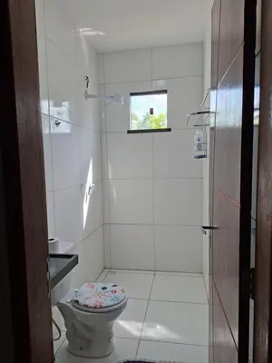 Uma casa de banho em Conforto pé na areia