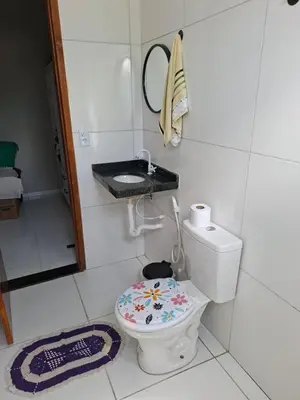 Uma casa de banho em Conforto pé na areia