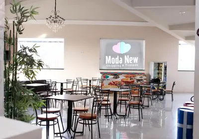 Um restaurante ou outro lugar para comer em Pousada Moda New