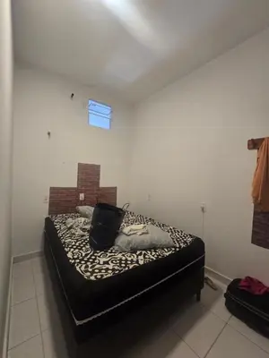 Uma cama ou camas num quarto em Casa Maúna