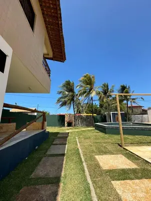 Um jardim no exterior de BRKITE Pousada