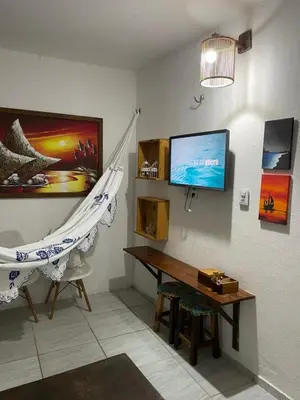 Uma televisão e/ou sistema de entretenimento em Casa De Vó