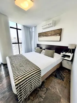 Uma cama ou camas num quarto em Brasil Tropical