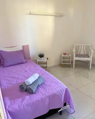 Uma cama ou camas num quarto em Casa Rios Taíba para viver dias incríveis