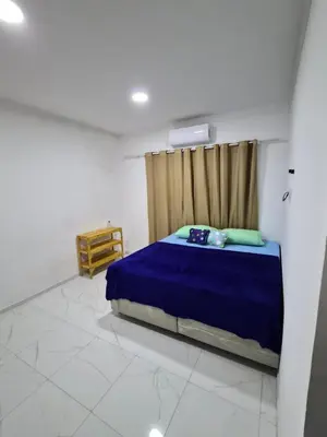 Uma cama ou camas num quarto em Casa Riso Dourado