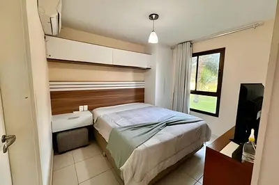 Uma cama ou camas num quarto em VG106 - VG SUN Cumbuco 100% nascente terreo por Will