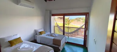 Uma cama ou camas num quarto em Conduru Preá Kite House
