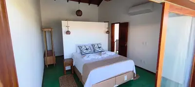 Uma cama ou camas num quarto em Conduru Preá Kite House