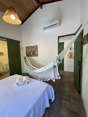 Uma cama ou camas num quarto em Casa Sabiá, Praia de Peroba, CE