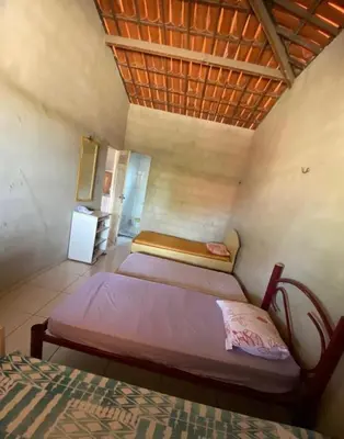 Uma cama ou camas num quarto em Casa no Paracuru