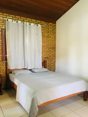 Uma cama ou camas num quarto em Club House Prainha - Aquiraz - Ceará