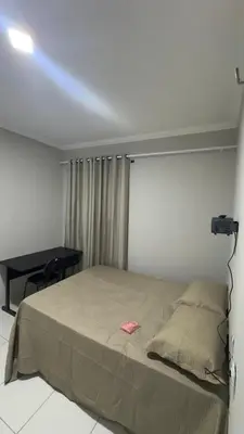 Uma cama ou camas num quarto em Condominio avenida