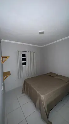 Uma cama ou camas num quarto em Condominio avenida