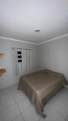 Uma cama ou camas num quarto em Condominio avenida