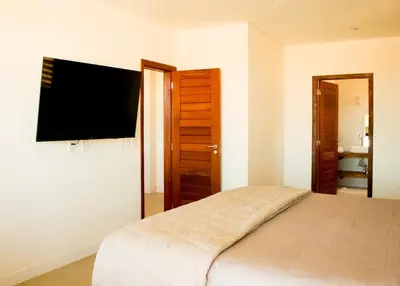 Uma cama ou camas num quarto em Casa Angatu Mansão paradisíaca no Preá