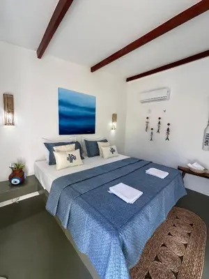 Uma cama ou camas num quarto em BaleiaLofts Kite Village