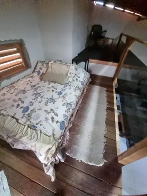 Uma cama ou camas num quarto em Refúgio Rústico