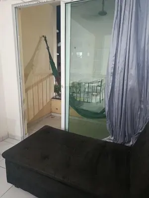 Uma cama ou camas num quarto em Rogerio AP Compartilhado