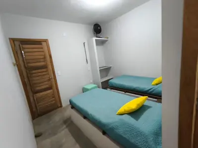 Uma cama ou camas num quarto em Casa mirante de Parajuru