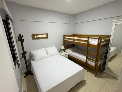 Uma cama ou camas num quarto em Apartamento Porto das Dunas