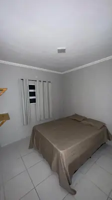 Uma cama ou camas num quarto em Condomínio Avenida