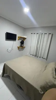 Uma cama ou camas num quarto em Condominio Avenida