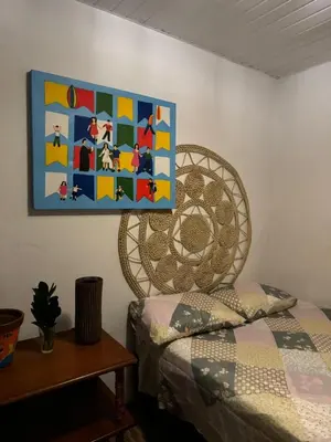 Uma cama ou camas num quarto em Casas do Ton na Praia da Redonda