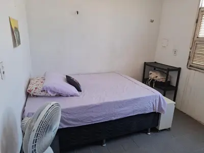 Uma cama ou camas num quarto em Casa do Milota