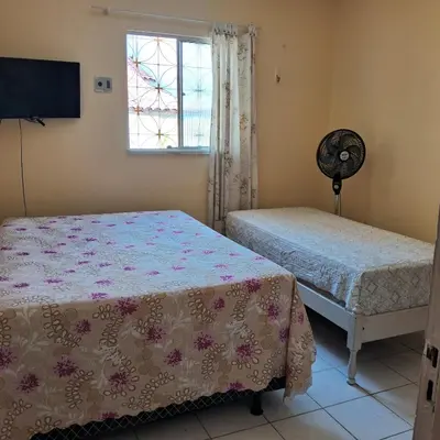 Uma cama ou camas num quarto em ZUM HOSPEDAGEM Fortaleza