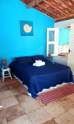 Uma cama ou camas num quarto em Chalé Jasmine Taiba