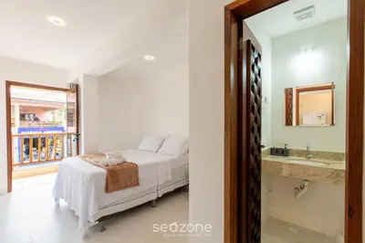 Uma cama ou camas num quarto em Ed Cumbuco Real | Aptos Completos a 160m da Praia - MCUs