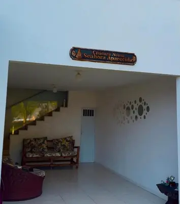 Uma área de estar em Chácara Lagoa do Banana Oficial