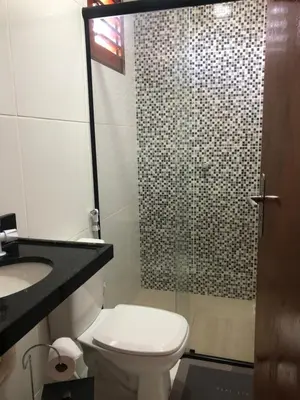 Uma casa de banho em Pousada casa sonho do mar