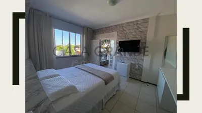 Uma televisão e/ou sistema de entretenimento em Pousada Casa Grande Aeroporto