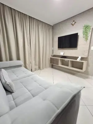 Uma televisão e/ou sistema de entretenimento em Apart 203 Vista Mar