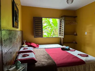 Uma cama ou camas num quarto em Chalé Luz de São Miguel