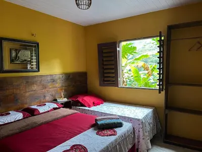 Uma cama ou camas num quarto em Chalé Luz de São Miguel