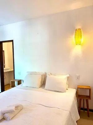 Uma cama ou camas num quarto em Villa Puglia Jeri Suítes